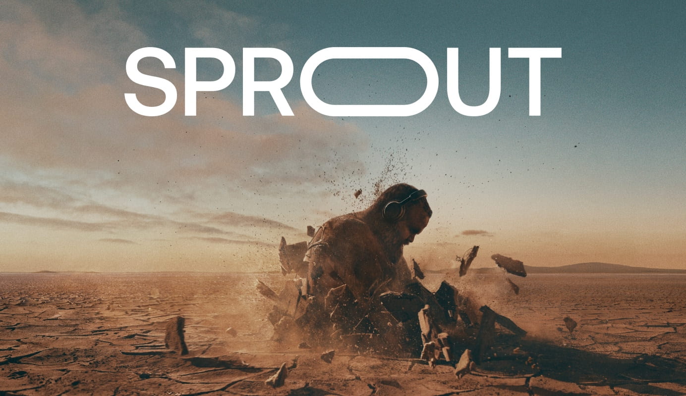 A wide-angle view of a dry desert landscape against a dusty blue sky, featuring Australian rap music artist Briggs exploding through the cracked earth, wearing headphones.  