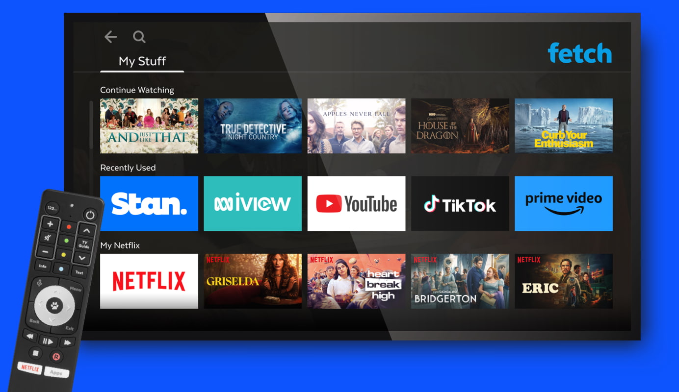 Tv showing the fetch interface overlayed by a remote control.